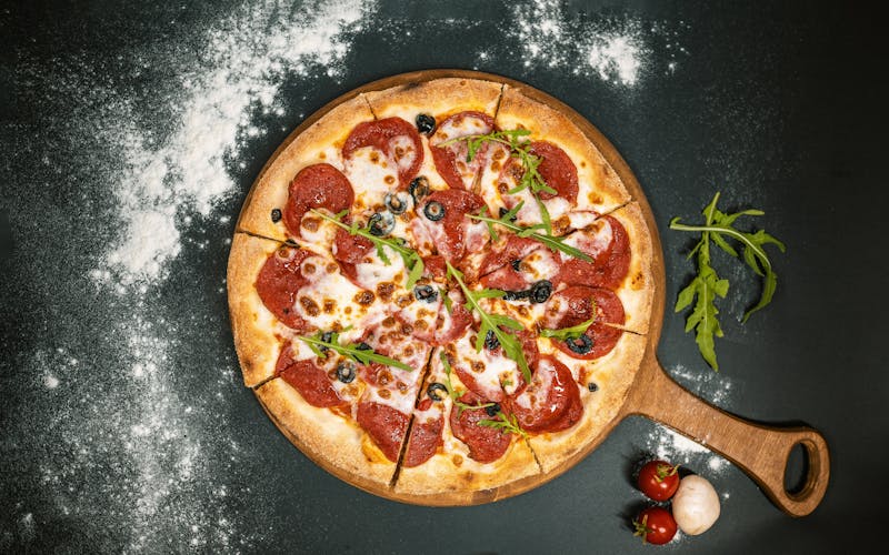 Pepperoni pizza fresh from wood-fired oven